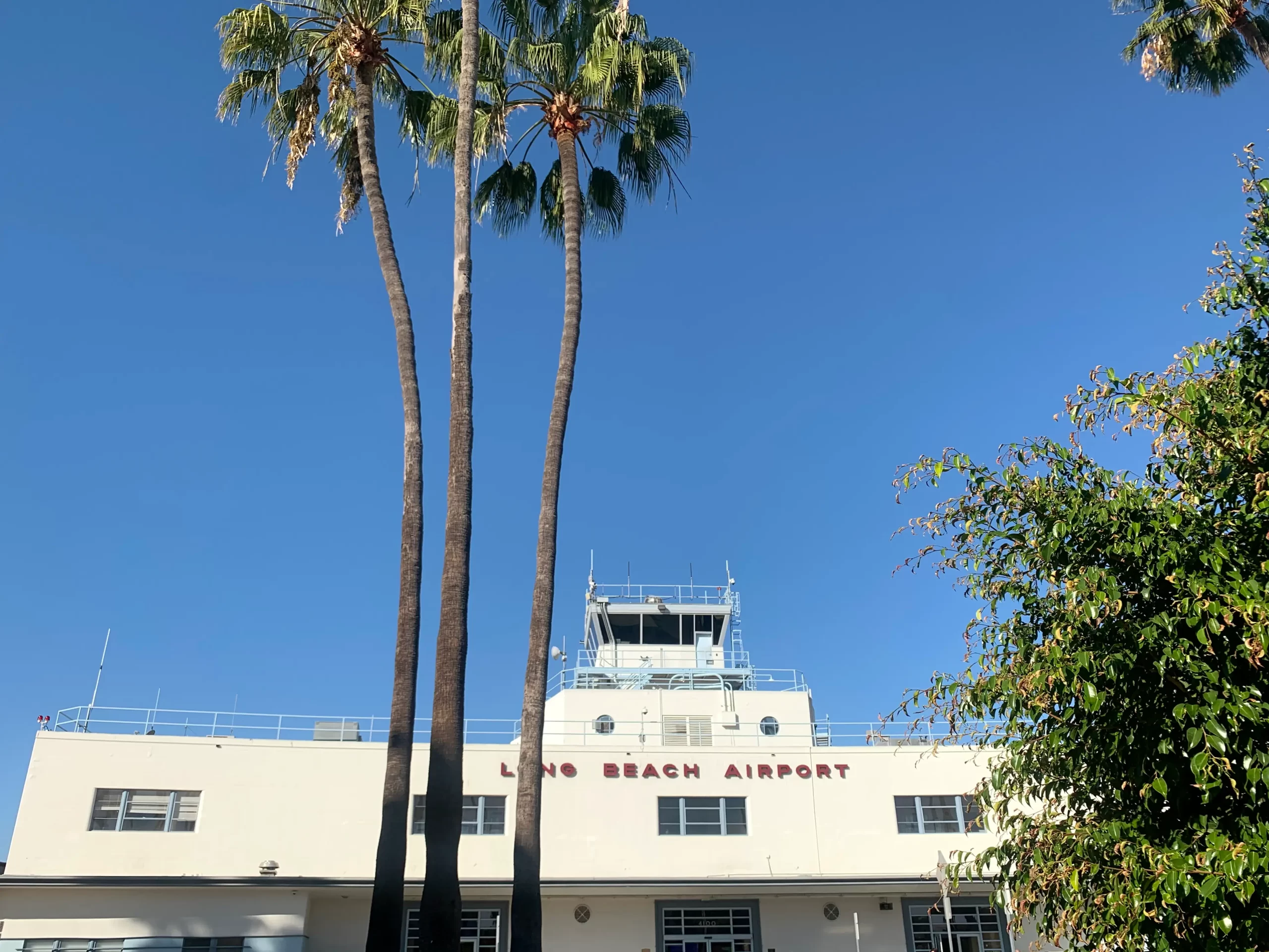 Long Beach airport with palm trees in foreground